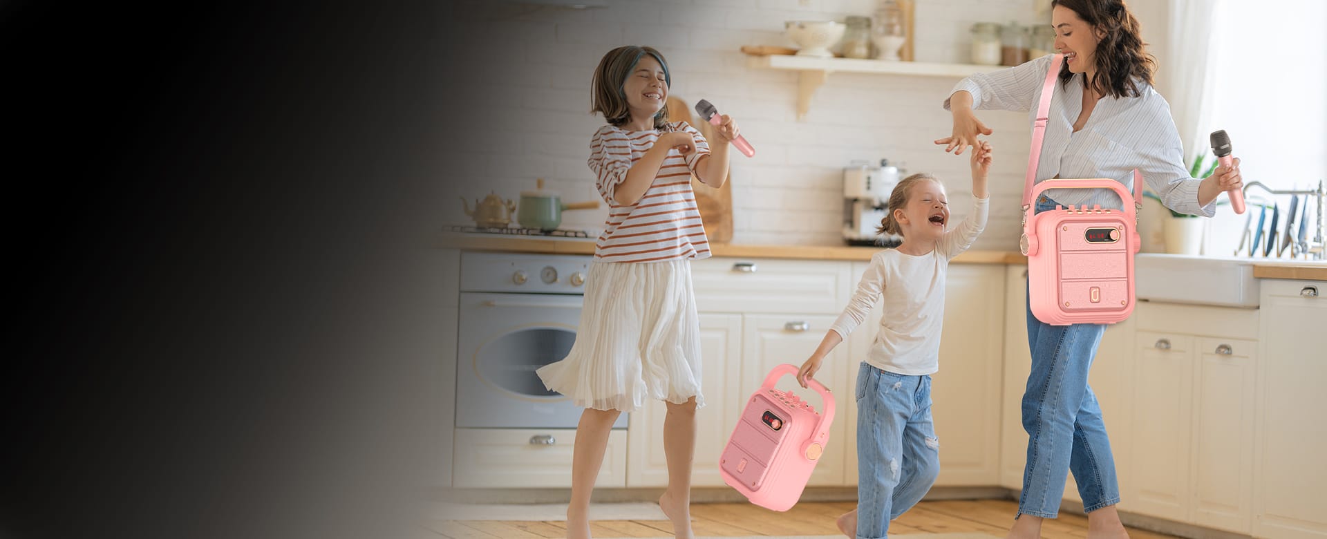 Girls are carrying JYX TX02 portable karaoke machine with 2 wireless microphones by handle and shoulder strap
