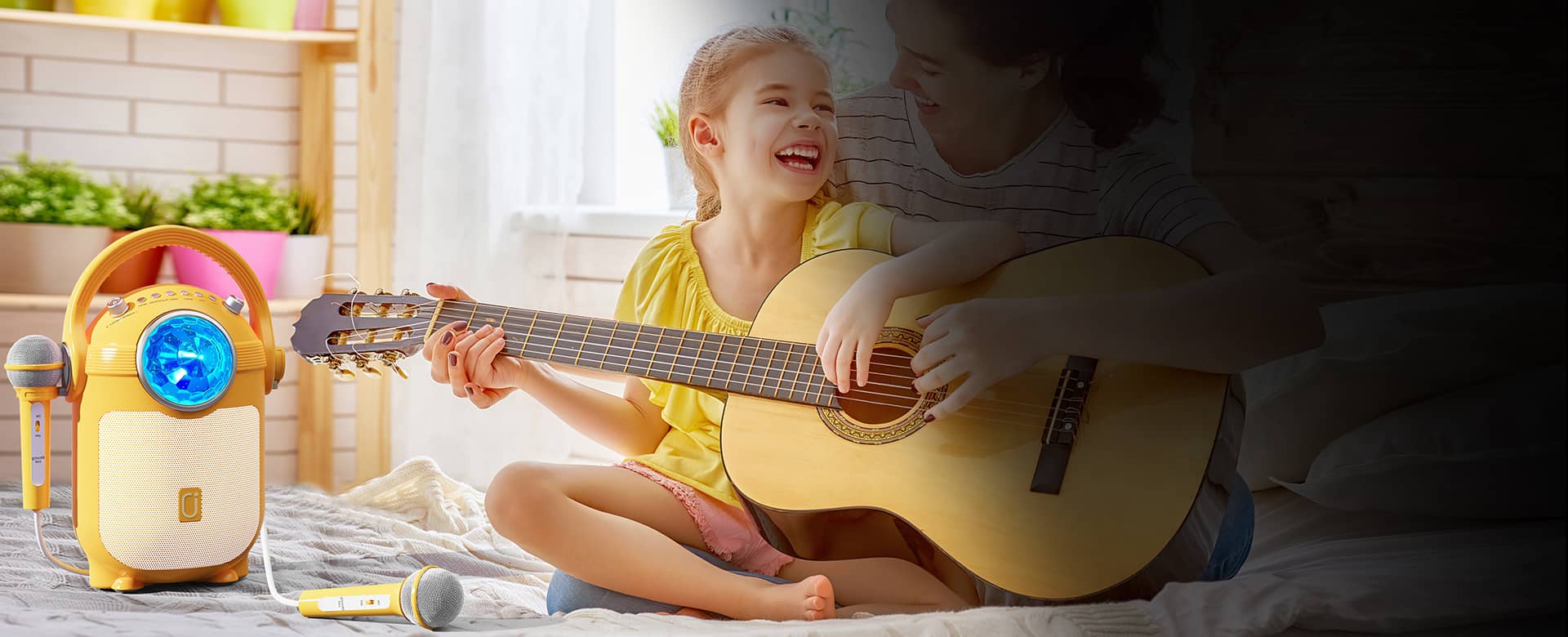 Gilrs are playing guitar by JYX D15 karaoke machind for kids