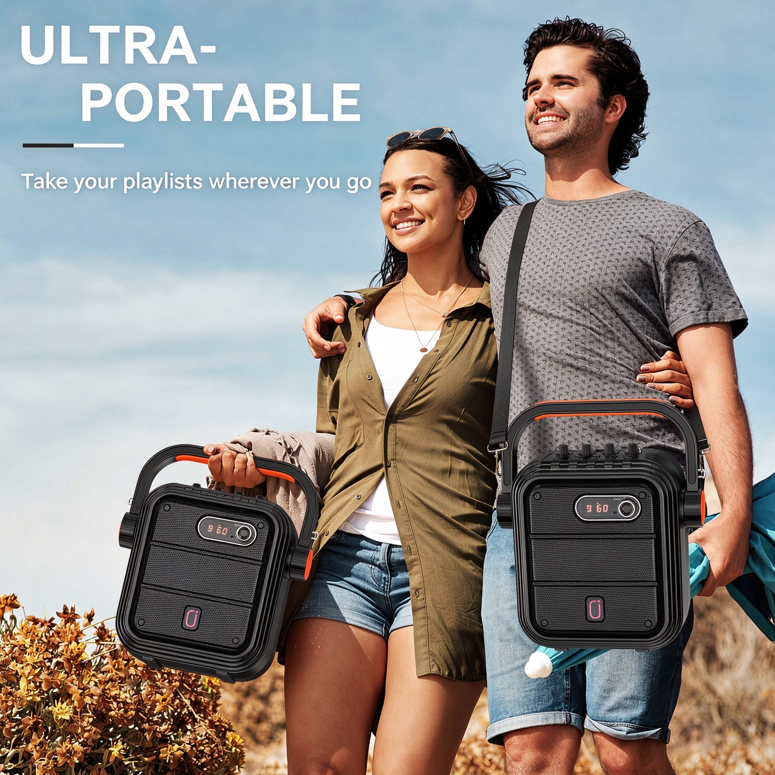 A couple carrying JYX 66BT portable karaoke speakers by their handles and shoulder straps while enjoying an outdoor trip