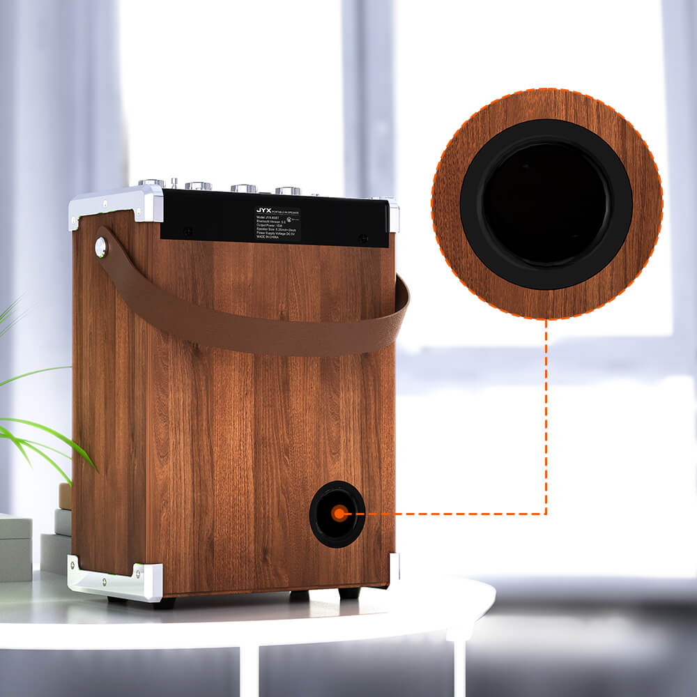 Rear view of the wood-grain JYX 69BT karaoke speaker showing the bass reflex port, designed to support airflow and low-frequency sound reproduction.