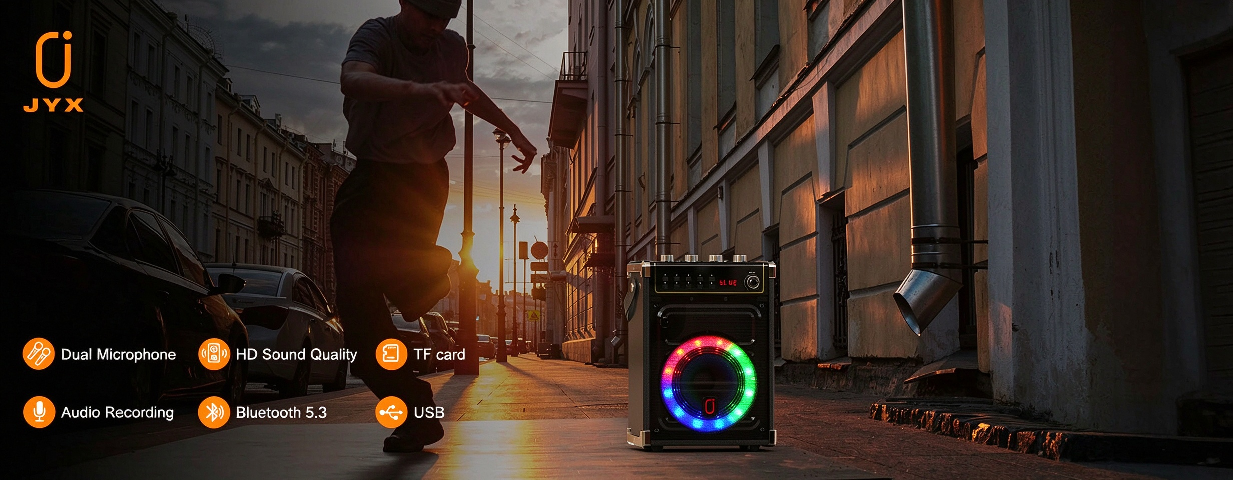 JYX 69BT portable karaoke speaker with colorful LED lighting in an urban street setting, featuring dual microphones, Bluetooth 5.3, USB playback, TF card support, and audio recording.