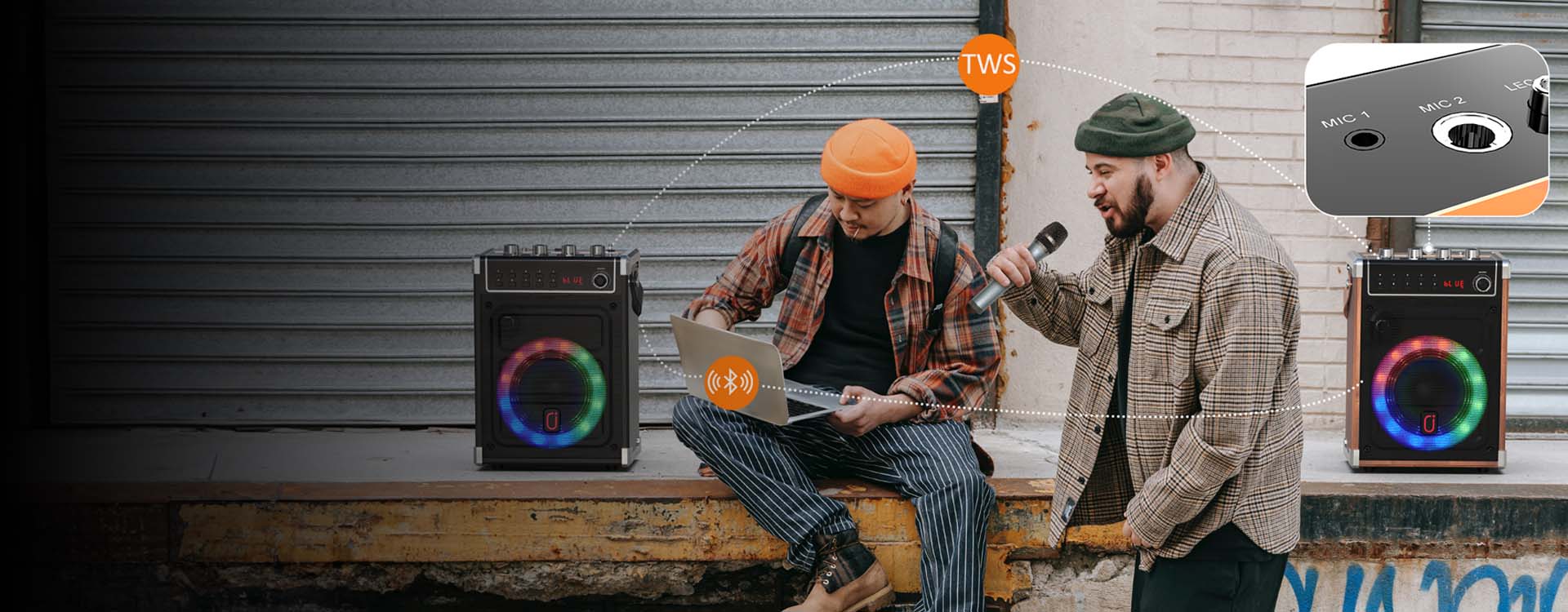Two JYX 69BT karaoke speakers with RGB lighting connected for TWS wireless stereo playback while friends enjoy music and singing outdoors.