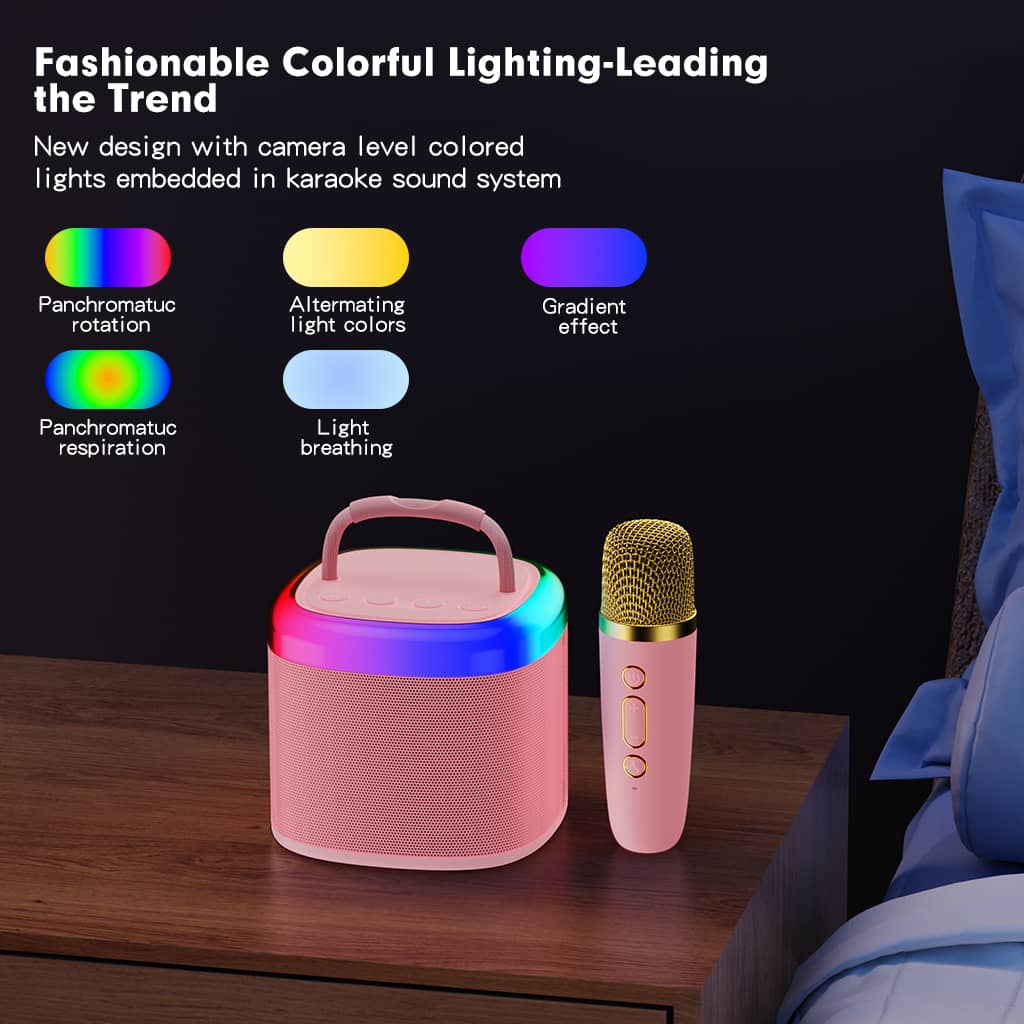 Pink JYX D17 karaoke speaker and matching microphone on a bedside table, with illustrations of multicolor rotation, alternating colors, gradient lighting, and breathing effects.