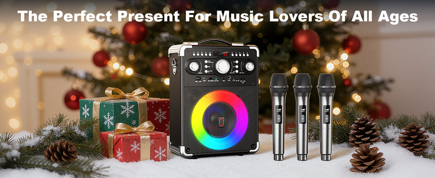 JYX S8 karaoke speaker and three wireless microphones displayed beside wrapped Christmas presents, pine branches, and festive decorations as a gift idea for music lovers.